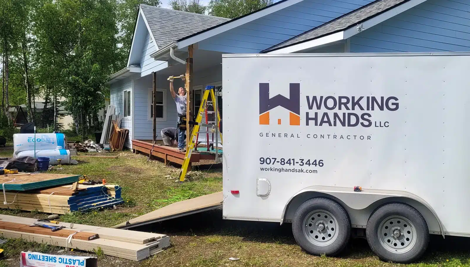 Working Hands LLC branded job site trailer showing a contractor brand identity in Alaska