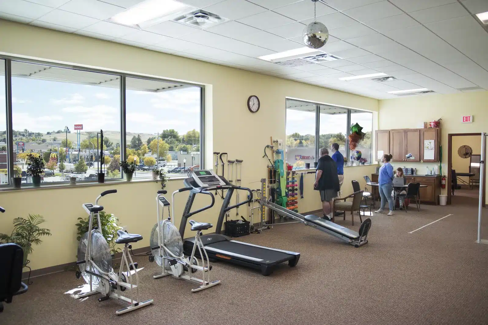 Physical therapy clinic gym with mountain views, business photography for local SEO in Alaska