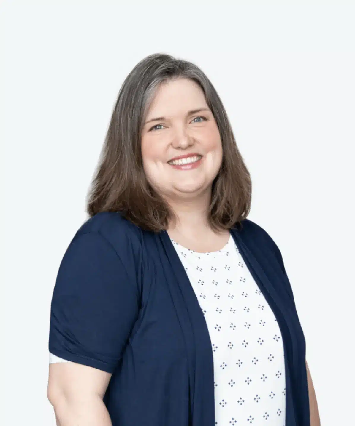 Professional studio headshot of a smiling team member on a white background